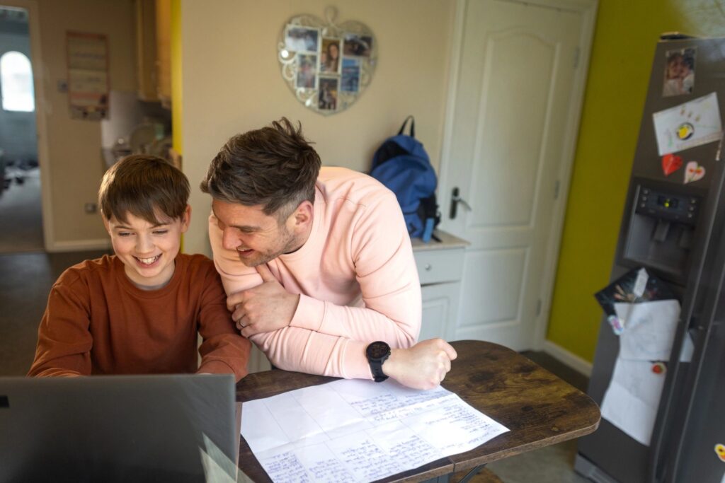 smiling parent with child paperwork